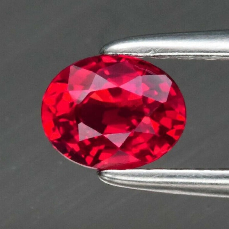 0.43 ct. Natural Orangish Red Ruby - TANZANIA: 0.43 ct. Natural Orangish Red Ruby - TANZANIA Shape - Oval Color - Orangish Red Clarity - VVS Ct. Weight - 0.43 ct. Dimensions - 5.00 x 4.00 x 2.60 mm Origin - TANZANIA</