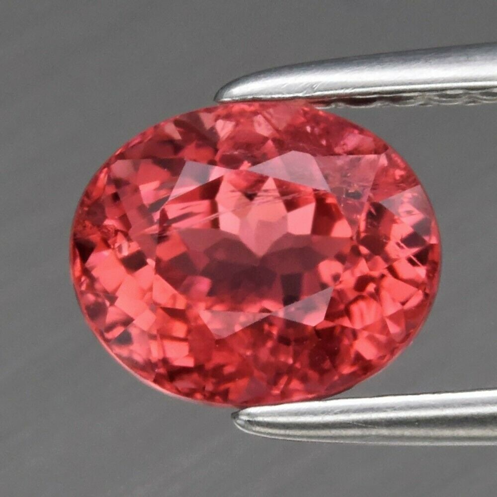1.55 ct. Natural Unheated Padparadscha color Tourmaline - MOZAMBIQUE: 1.55 ct. Natural Unheated Padparadscha color Tourmaline - MOZAMBIQUE Shape - Oval Color - Orangish Pink Clarity - SI Ct. Weight - 1.55 ct. Dimensions - 7.00 x 6.00 x 5.20 mm