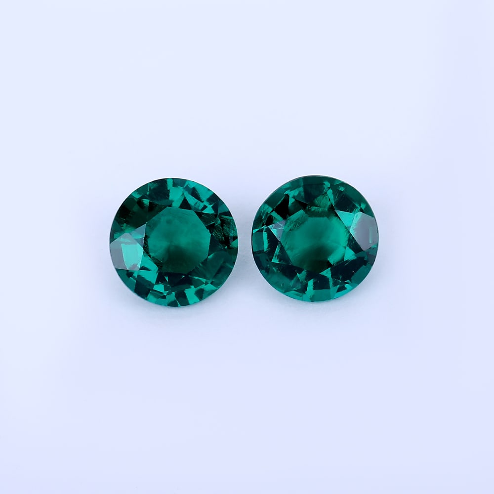 4.62 ct. Pair of Vivid Green Emeralds - COLOMBIA: 4.62 ct. Pair of Vivid Green Emeralds - COLOMBIA Ct. Wt. - 4.62 ct. Color- Vivid Green Cut-Round Clarity - VS No. of Emeralds - 2 Origin - COLOMBIA