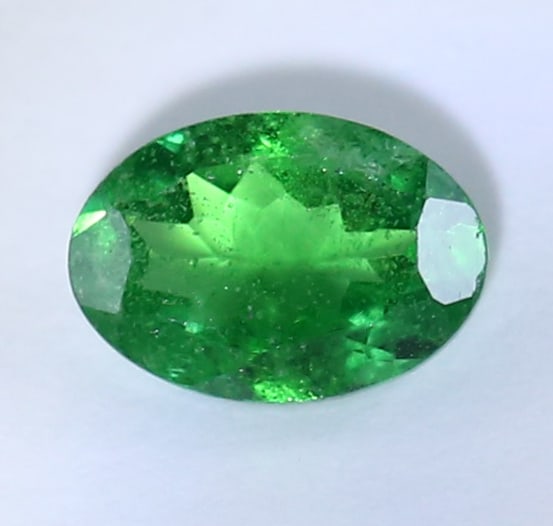 IGI Certified 0.79 ct. Tsavorite Garnet Untreated KENYA: IGI Certified 0.79 ct. Tsavorite (Grossularite - Garnet) Untreated KENYA Cut - Oval Mixed Cut Color - Green Clarity - VS Ct. Weight - 0.79 ct. Dimensions - 6.85x 4.77 x 2.90 mm