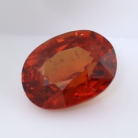 IGI Certified 1.57 ct. Red Orange Sapphire - MADAGASCAR: IGI Certified 1.57 ct. Red Orange Sapphire - MADAGASCAR Color - Red Orange Cut - Oval Mixed cut Ct. wt. - 1.57 ct. Clarity - VS Dimensions - 7.53 x 5.99 x 3.94 mm Treatment - Enh