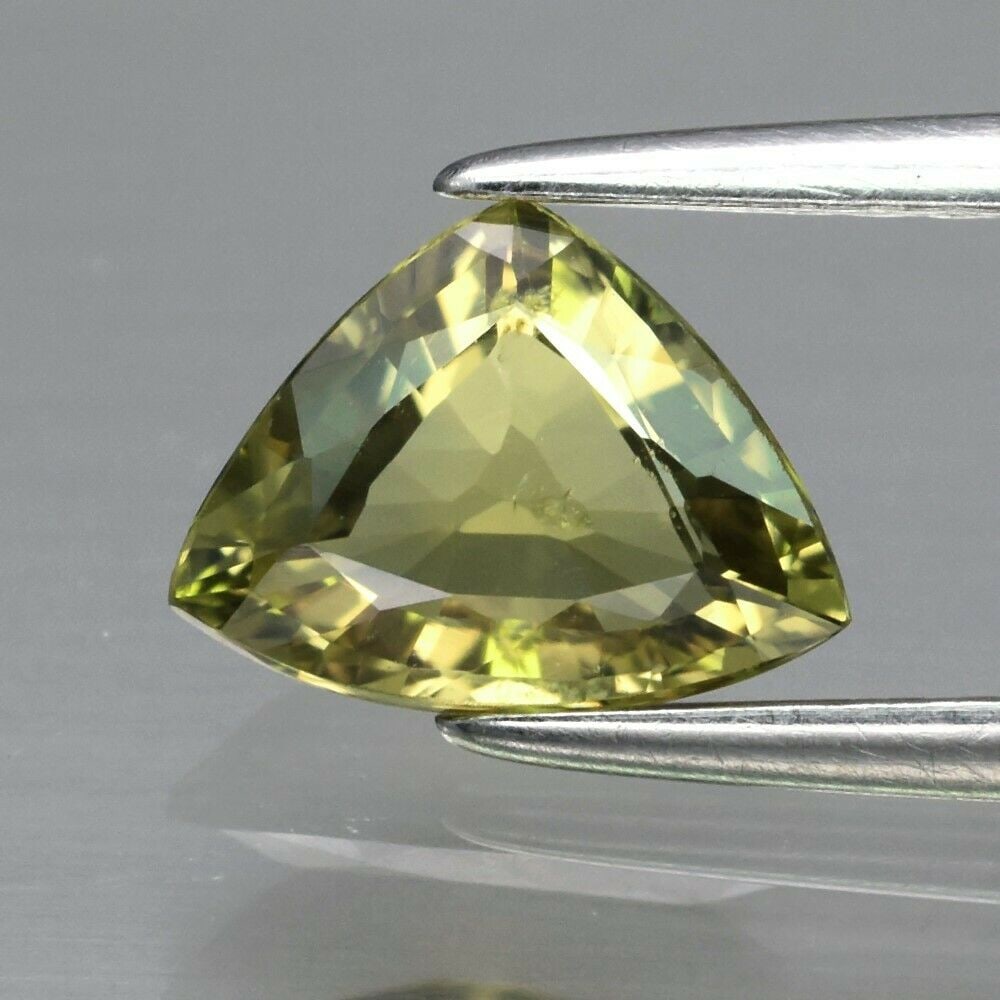 1.01 ct. Natural Unheated Greenish Yellow Sapphire - TANZANIA: 1.01 ct. Natural Unheated Greenish Yellow Sapphire - TANZANIA Color - Greenish Yellow Cut - Trillion Clarity - VS Ct. wt. - 1.01 ct. Dimensions - 7.70 x 6.00 x 2.80 mm Origin - <