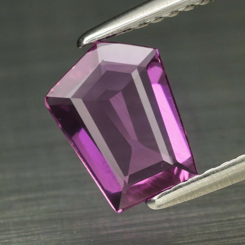 IGI Certified 0.89 ct. Natural Purplish Pink Sapphire - MADAGASCAR, AFRICA: IGI Certified 0.89 ct. Natural Purplish Pink Sapphire - MADAGASCAR, AFRICA Color - Purplish Pink Cut - Shield Step cut Ct. Wt. - 0.89 ct. Clarity - IF Dimensions - 8.46 x 6.33 x 1.72 mm