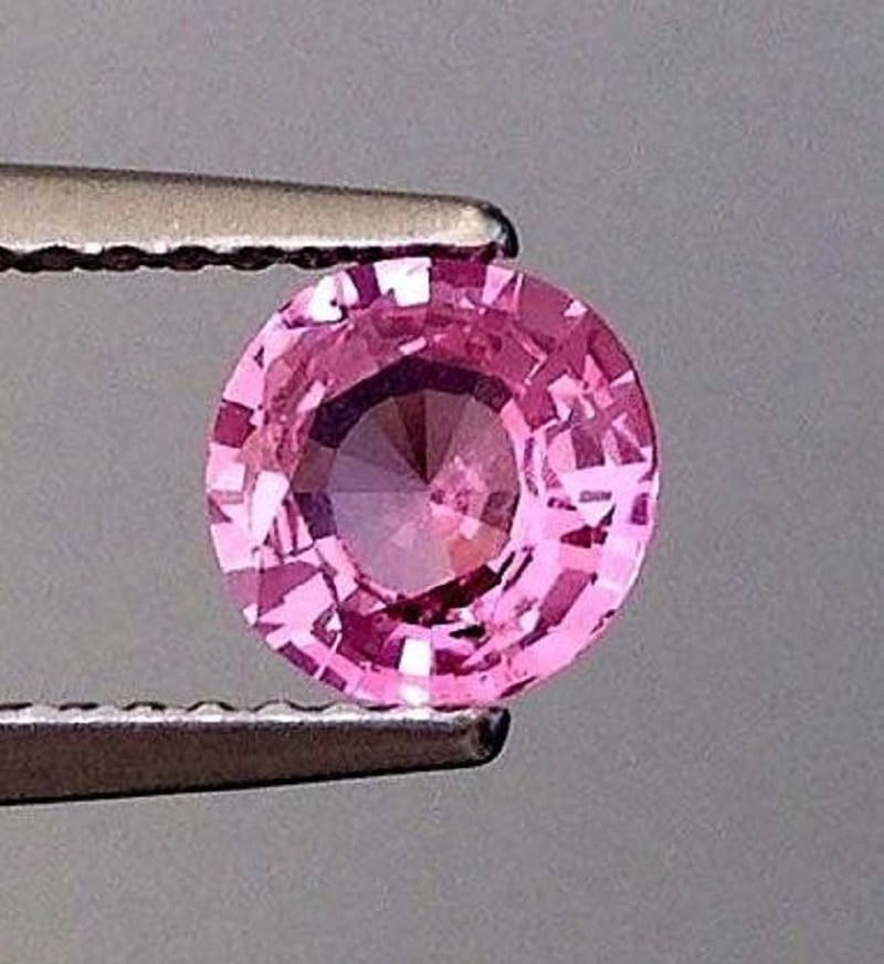 GRS Certified 0.80 ct. Padparadscha Sapphire - MADAGASCAR: GRS Certified 0.80 ct. Padparadscha Sapphire - MADAGASCAR Ct. Wt. - 0.80 ct. Color - Orangy Pink Cut - Round Brilliant Step cut Clarity - VS-SI Origin - MADAGASCAR (