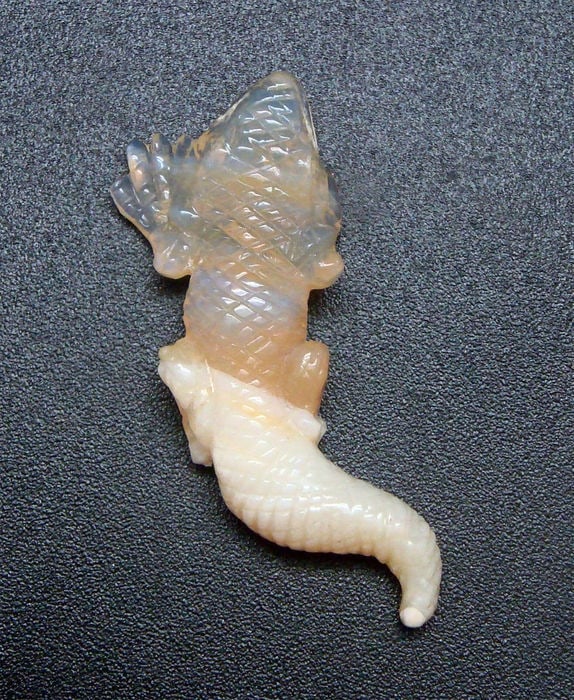 IGI Cert. 14.20 ct. Opal Fine Carving Quality AUSTRALIA: IGI Certified 14.20 ct. Opal Fine Carving Quality AUSTRALIA Fine Quality Carving (Hand Carved) - On Report Cut - Carved Color - White Clarity - Translucent Ct. wt. - 1