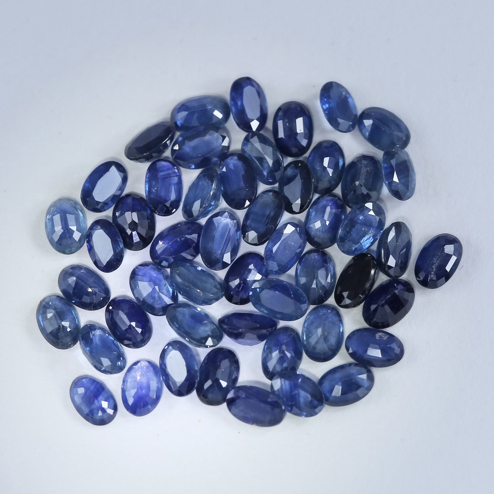 27.87 ct. Oval Shape Blue Sapphire Lot - MADAGASCAR: 27.87 ct. Blue Sapphire Lot - MADAGASCAR Color - Blue - Dark Blue Cut - Oval Mixed Cut Ct. Wt. - 27.87 ct. Clarity - VS - SI Dimensions - Mix sizes : 4 mm x 5 mm No. of Sapphires - 50