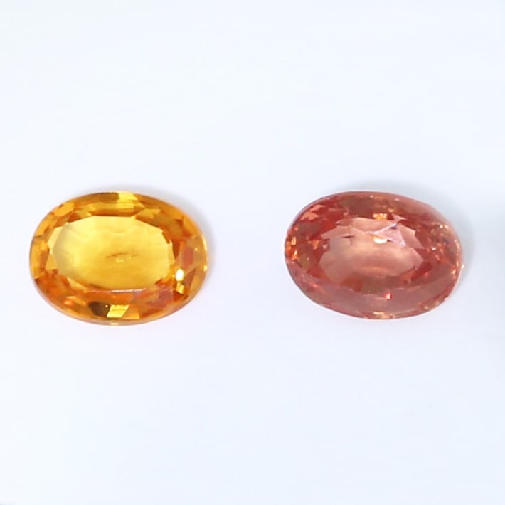 IGI certified Set of 2 Padparadscha Sapphires - MADAGASCAR: IGI certified Set of 2 Padparadscha Sapphires - MADAGASCAR Color - Pinkish Orange and Pink Orange Clarity - VS Cut - Oval Mixed Cut Weight - 0.27 + 0.18 = 0.45 ct. Dimensions - 3.96 x 2.97 x 2
