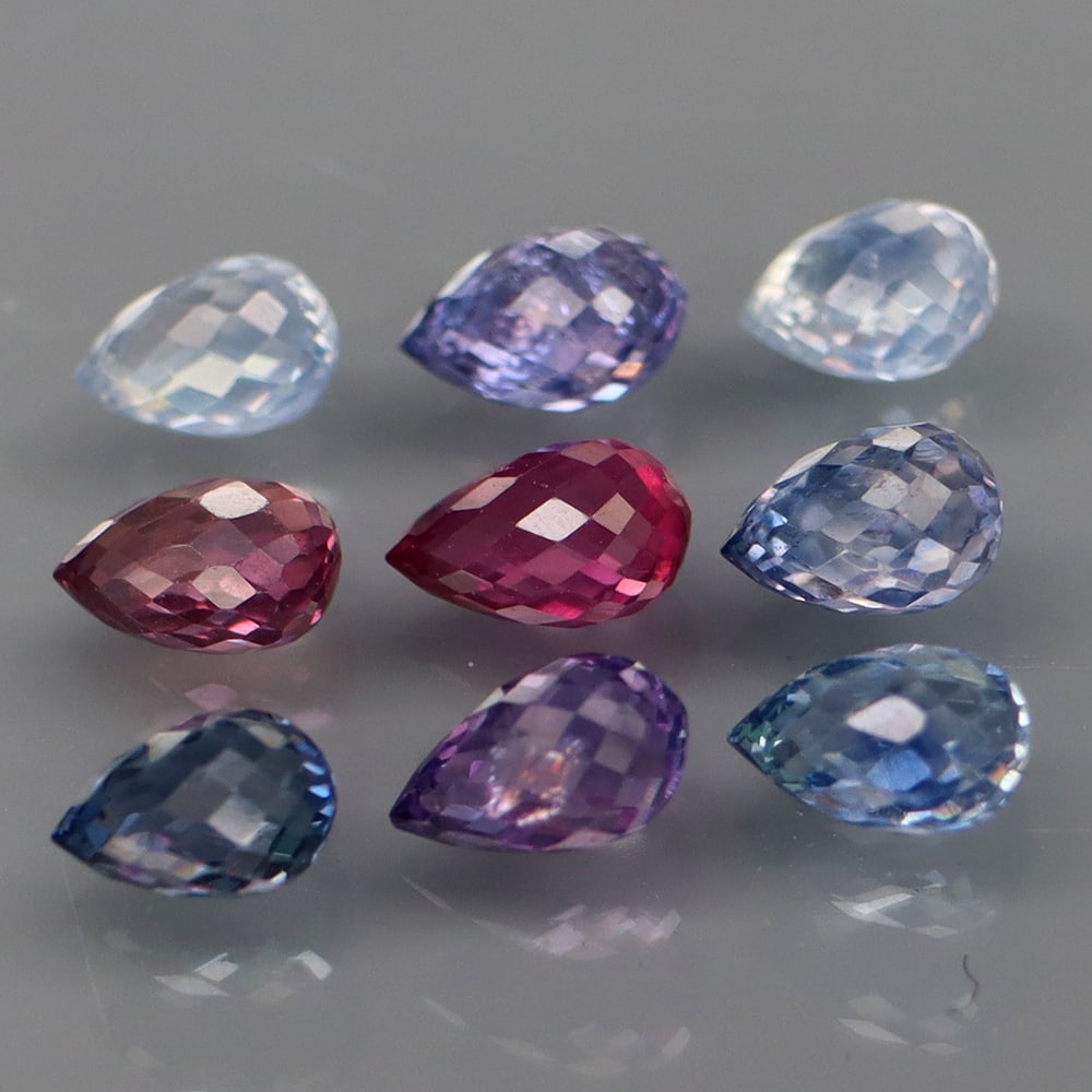 HGL Certified 4.56 ct. Sapphire Lot - MADAGASCAR: HGL Certified 4.56 ct. Sapphire Lot - MADAGASCAR Ct. Weight - 4.56 ct. Shape - Briolette Color - Red Pink Treatment - Heated Clarity - VS & SI No. of sapphires - 9