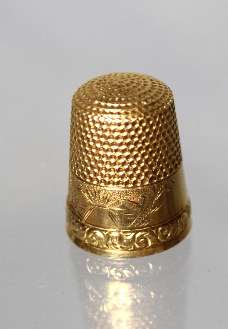 14KT YELLOW GOLD THIMBLE:: Engraved landscape decoration. Approximately 2.95 pennyweight.