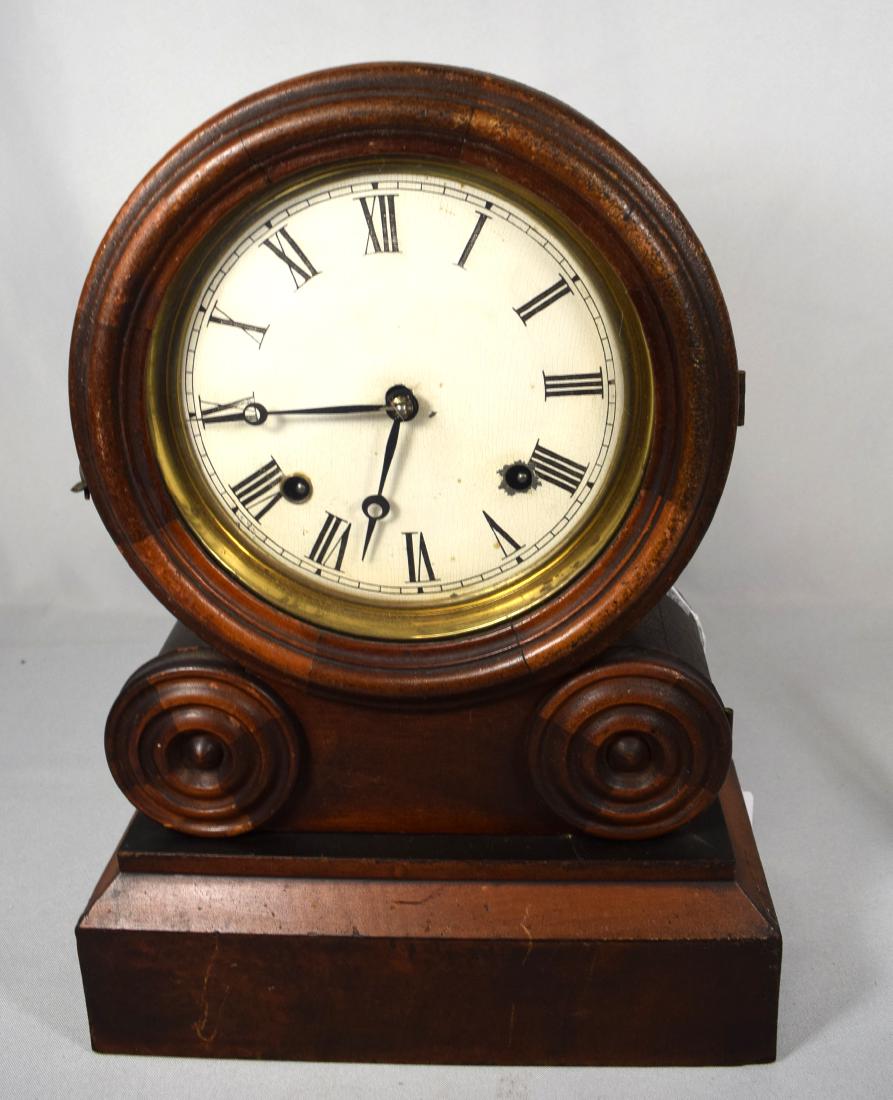 INGRAHAM DOUBLE SCROLL MANTLE CLOCK:: Mahogany and mahogany veneer. Patent date 1871. Interior paper label still intact. Key-wind.