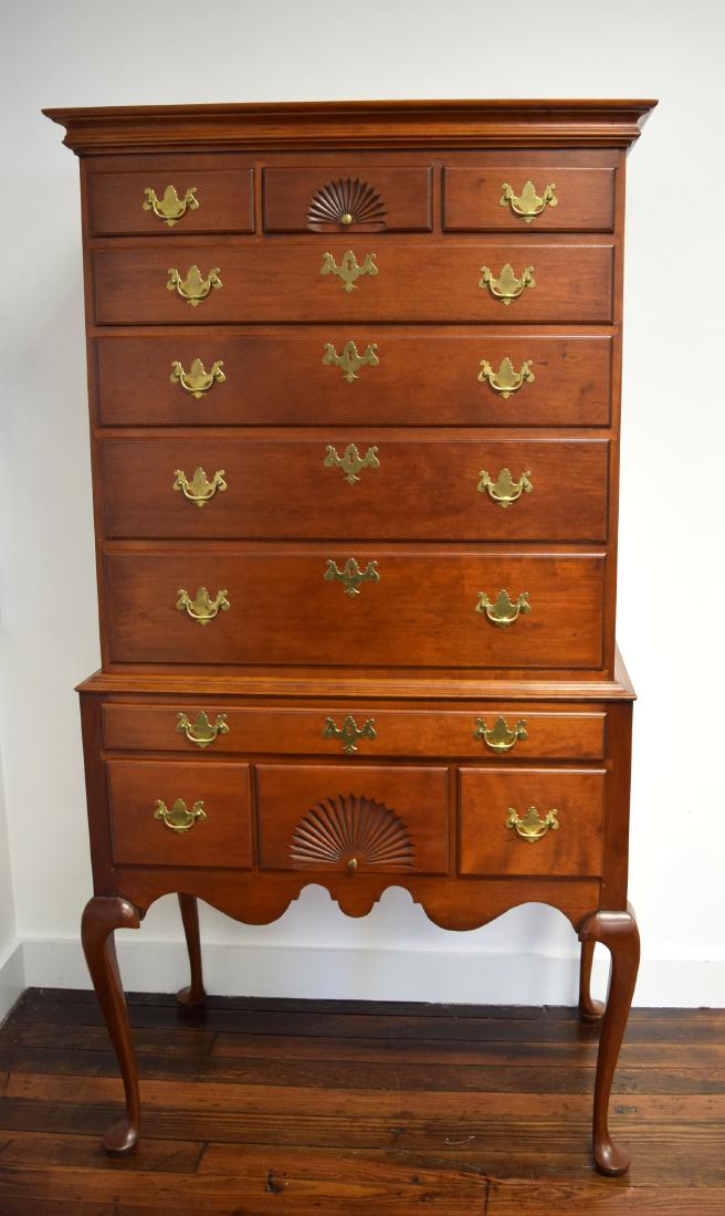 ELDRED WHEELER QUEEN ANNE STYLE HIGHBOY:: Handcrafted reproduction by Eldred Wheeler of Hingham, Massachusetts. Two pieces solid cherry. Top with three small drawers over four graduated drawers. Top center with carved fan. Bottom with top nar