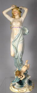 LATE 19TH C MEISSEN PORCELAIN FIGURINE:: Delicate fine porcelain and painted semi-nude female figures with shawl draped around her. She has come out of the ocean and stands with her long wet hair, strewn with waterlilies, blowing in the bree