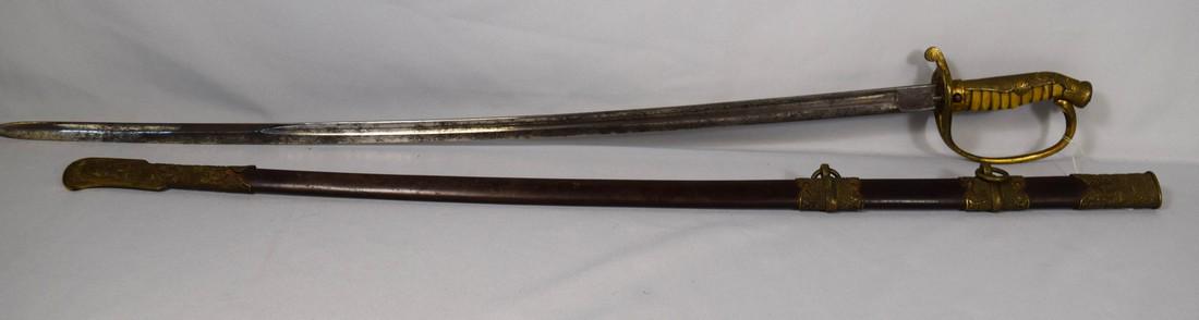 ASIAN SWORD:: Japanese or Korean sword and scabbard. WWII or perhaps earlier. Ornate unusual grip, guard and scabbard mounts. Decoration with repoussé chrysanthemum blossoms and leaves. Measures 39 inches overall.