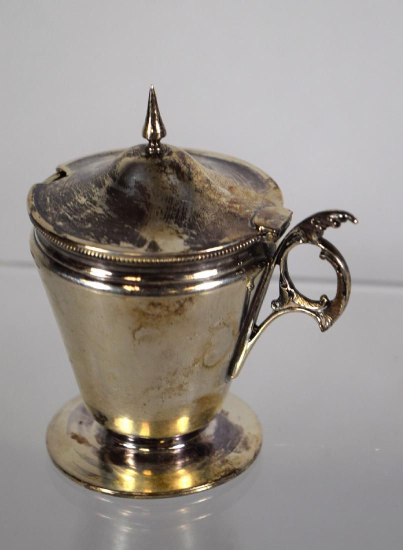 R. & W. WILSON GILT COIN SILVER MUSTARD POT:: Ca 1830. Feather design handle, spire finial, hinged lid, footed. Gold wash interior. Signed. R & W Wilson, Philad. Robert and William Wilson were the sons of early New York silversmith Robert Wilson
