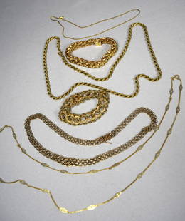 SIX PIECE 14KT YELLOW GOLD JEWELRY LOT:: Includes heavy rope chain necklace, 2 ornate multiple chain link bracelets, flat chain bracelet, fine chain and open work chain. Approximately 67.7 dwt.