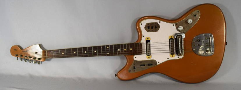 1972 ELECTRIC FENDER JAGUAR MODEL GUITAR:: The 1972 Jaguar with solid body, original case. Serial L10101. Original copper color. Six strings. Original decals