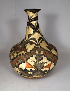 ACOMA NATIVE AMERICAN INDIAN BOTTLE FORM POTTERY VASE:: Ca early 20th century. Ornate geometric and symbolic design on buff ground. Colors of brown, orange, gold and black. Bulbous bottle form shape. Measures 14 inches tall x 11 inches wide.