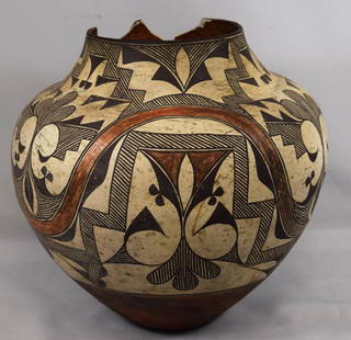 NATIVE AMERICAN ACOMA POTTERY POT:: New Mexico ca 19th century. Large pottery piece, 13 inches tall x 14 ½ inches wide. Acoma pottery is emblematic of the lifestyle of people who make it. It typically features thin walls, fluted rims,