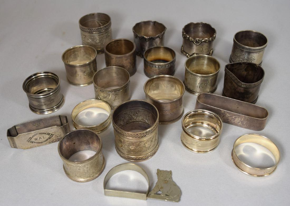 ASSEMBLED STERLING SILVER NAPKIN RINGS & SILVERPLATED: Nineteen pieces. Approximately 6.5 troy ounces sterling. (12 silver-plated napkin rings). Various makers and patterns.