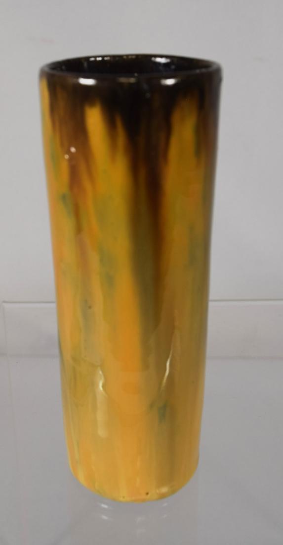 FULPER ART POTTERY STRAIGHT VASE:: Oval mark 1917-1934. Measures 5 ½ inches x 2 inches diameter. Tans/brown flambe glaze.