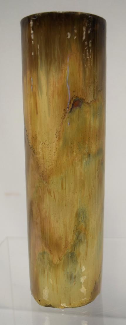 FULPER ART POTTERY STRAIGHT VASE:: Oval mark 1917-1934. Measures 10 ½ inches x 3 inches diameter. Tans/brown blue flambe glaze.