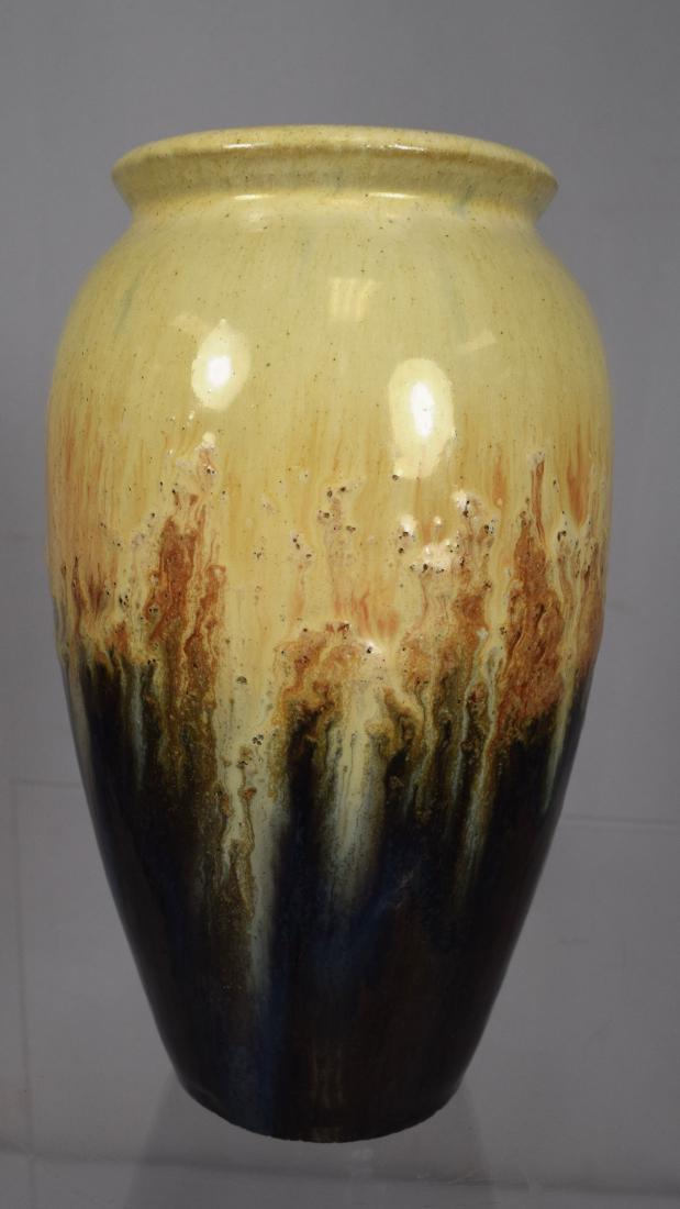 FULPER ART POTTERY VASE:: Vertical raised mark 1917-1920. Measures 7 inches x 5 inches diameter. Gloppy yellow flow over brown glaze.