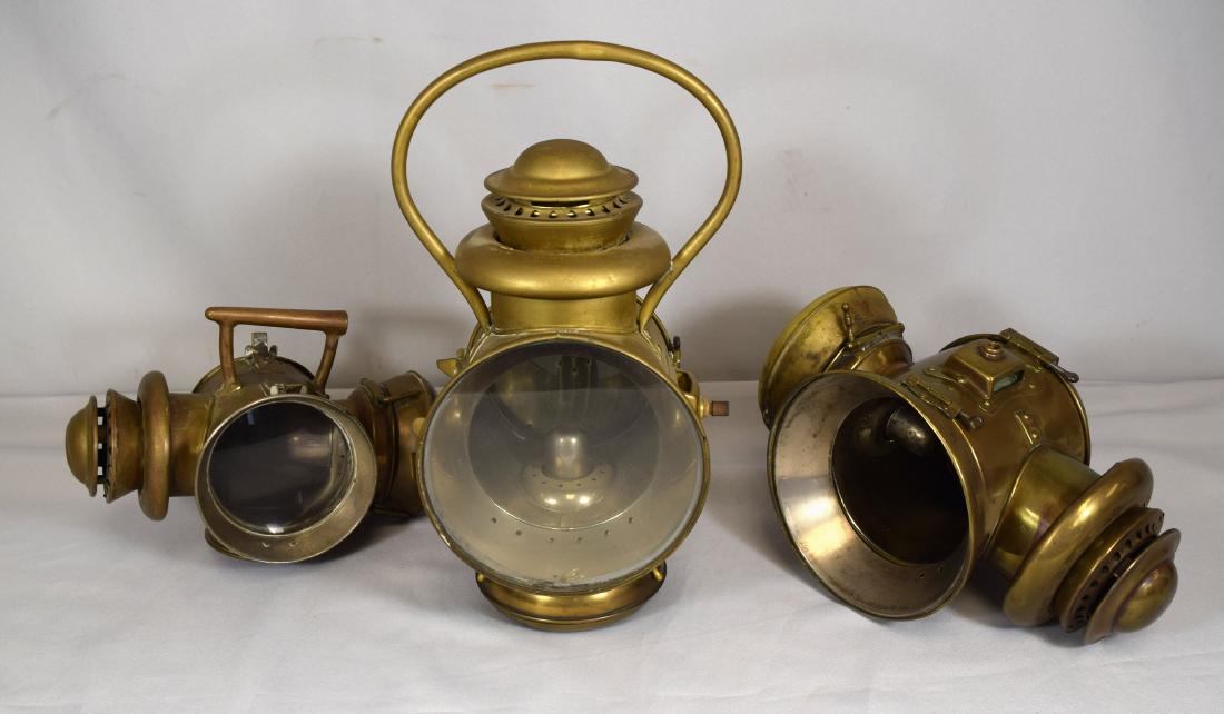 SET STEVENS DURYEA BRASS AUTO LANTERNS & BRASS TAIL: Antique turn of the century. Three piece set. Pattern dates on base. All have plaque Stevens Duryea. Embossed on lamps Vigilant Cold Blast Inspector & Tail Lamp CT Ham Mfg. Co. One lantern no lens and