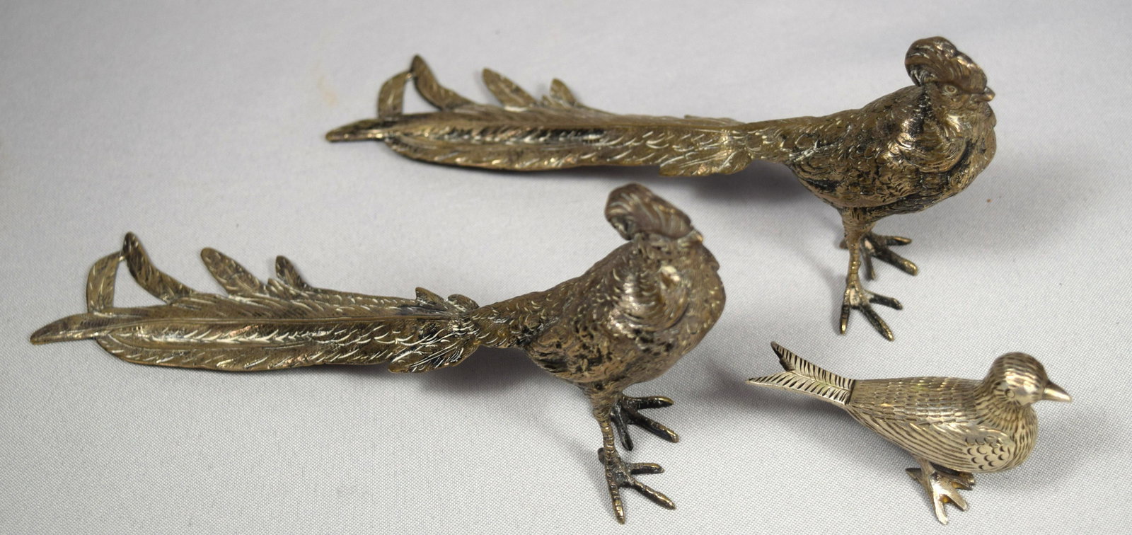 THREE SILVER 800 PERUZZI BIRDS: : Pair and smaller bird. Large birds signed Peruzzi Silver 800, Florence. Approximately 11 troy ounces