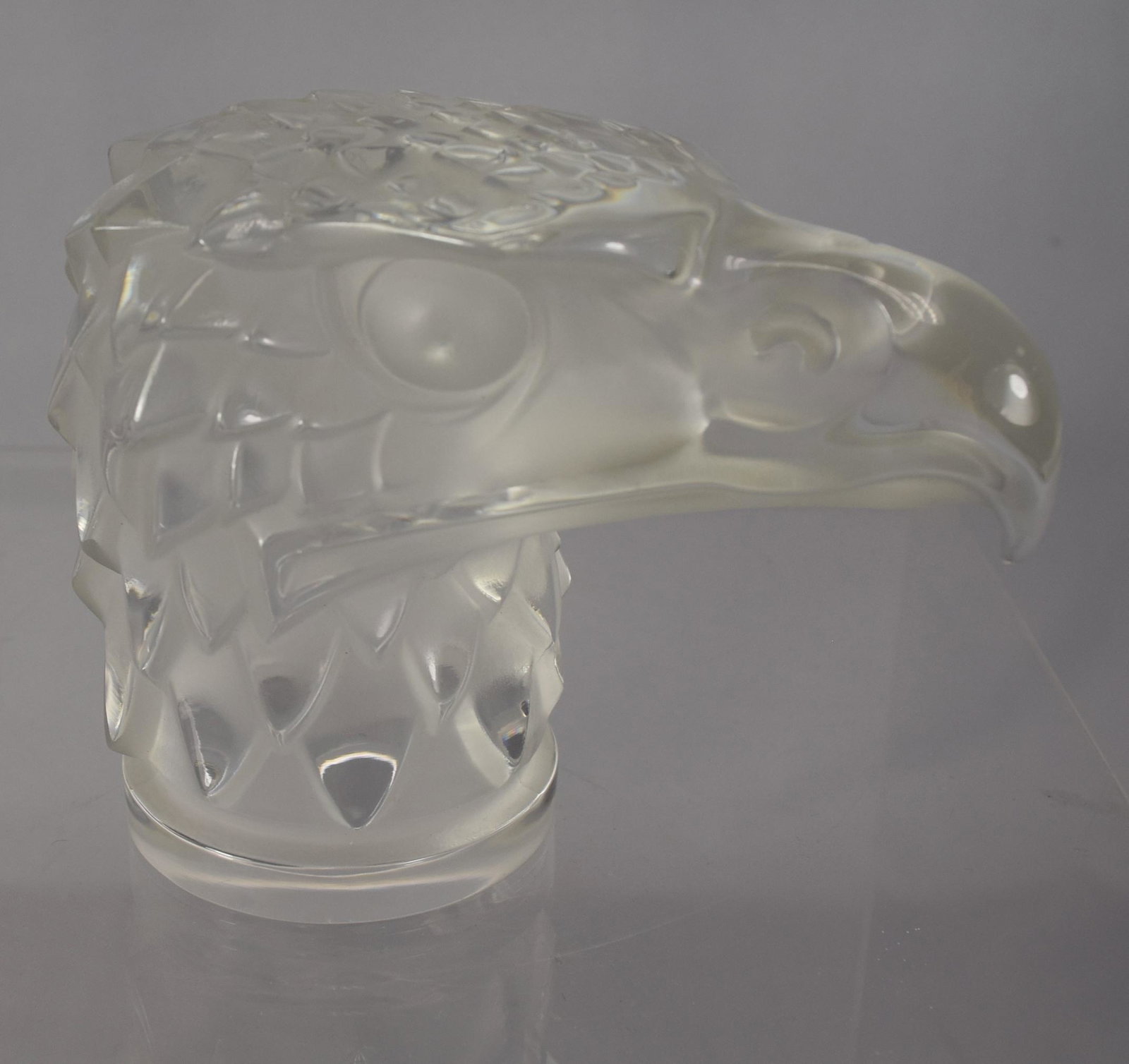CRYSTAL LALIQUE/FRANCE EAGLE HEAD AUTOMOBILE MASCOT: Crystal Lalique eagle head "Te D'Aigle", (originally R. Lalique 1928). Head is polished crystal with relief in smoke crystal. The Lalique Eagle Head was used as a Packard Automobile Hood Ornament, Rad
