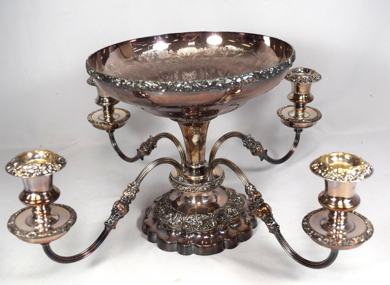 ELLIS BARKER SILVER-PLATED EPERGNE CANDLEHOLDER: : Decorated in the Rococco style. Ca 20thcentury. Ellis Barker Silver plate epergne with candle sconces. Signed. Four light with center bowl. Mark of Barker Ellis. Convertible form with large central bo