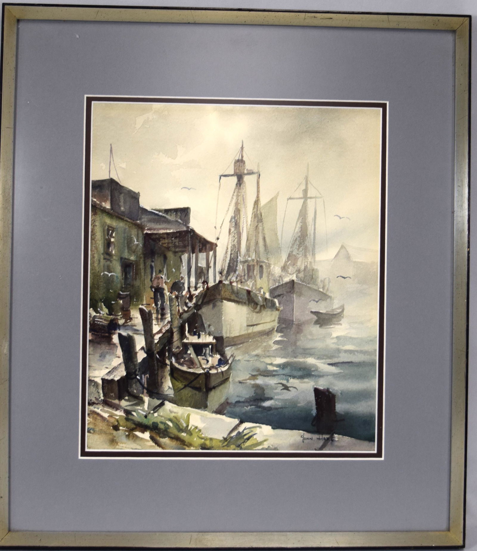 JOHN CUTHBERT HARE WATERCOLOR:: Scene with fishing boats in the fog alongside of the dock. John Cuthbert Hare (1908-1978 Massachusetts/Florida), was a watercolorist who painted boats, seascapes and harbor scenes. He was primarily