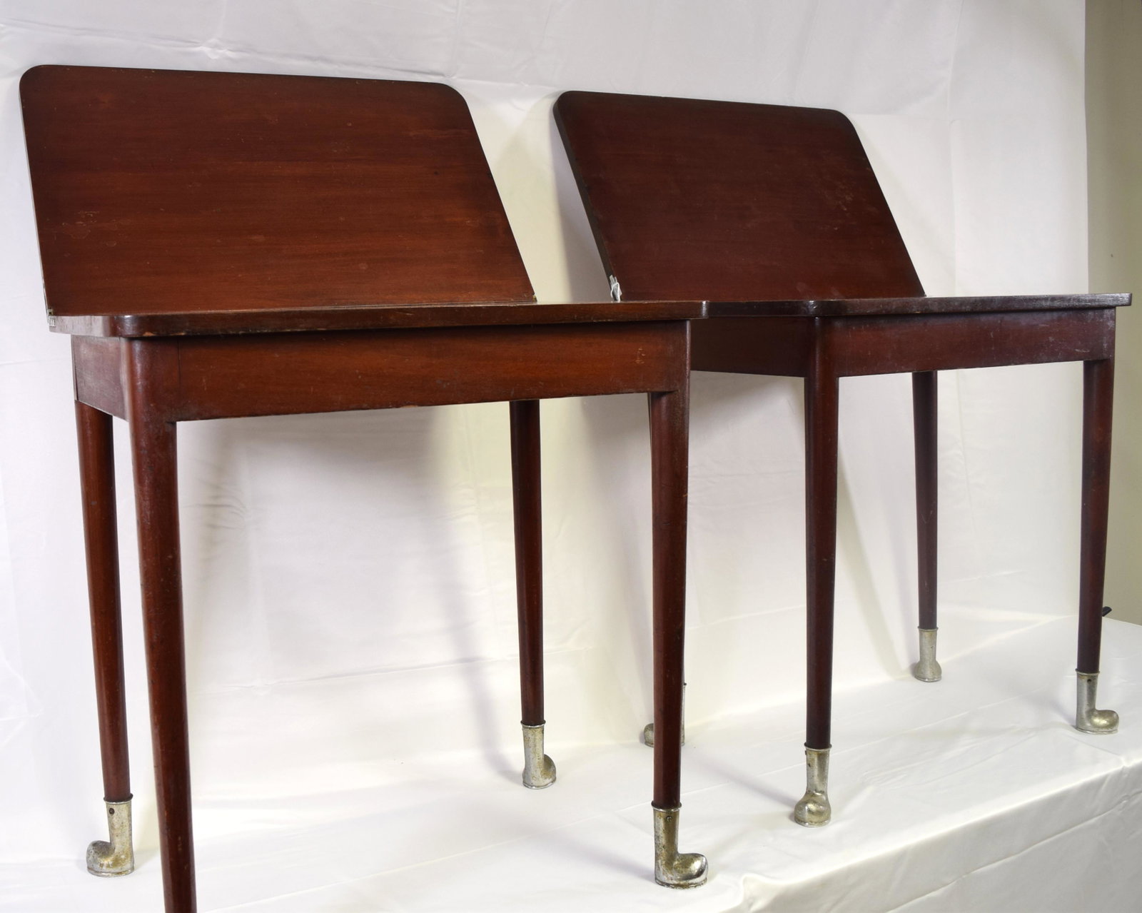PAIR OF FALL RIVER RAILROAD LINE TABLES:: Ca. 1893-1920’s. Attributed to Fall River Railroad (Old Colony Railroad) line, Fall River, Massachusetts. Mahogany pull out extension table with nickel plated brass feet which could be fastened to t