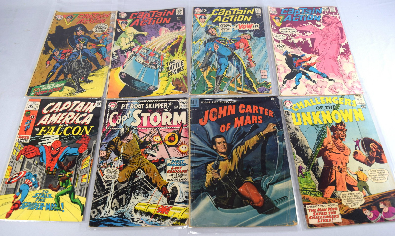 “C” 18 VINTAGE GOLD, SILVER & BRONZE COMIC BOOKS: Consisting of 1) Captain Action number #1, 2, 3, 4. 2) Captain America #137. 3) Captain Storm #4. 4) John Carter of Mars number #488. (Wear to cover). 5) Challengers of the Unknown numbers 31, 39, 41,