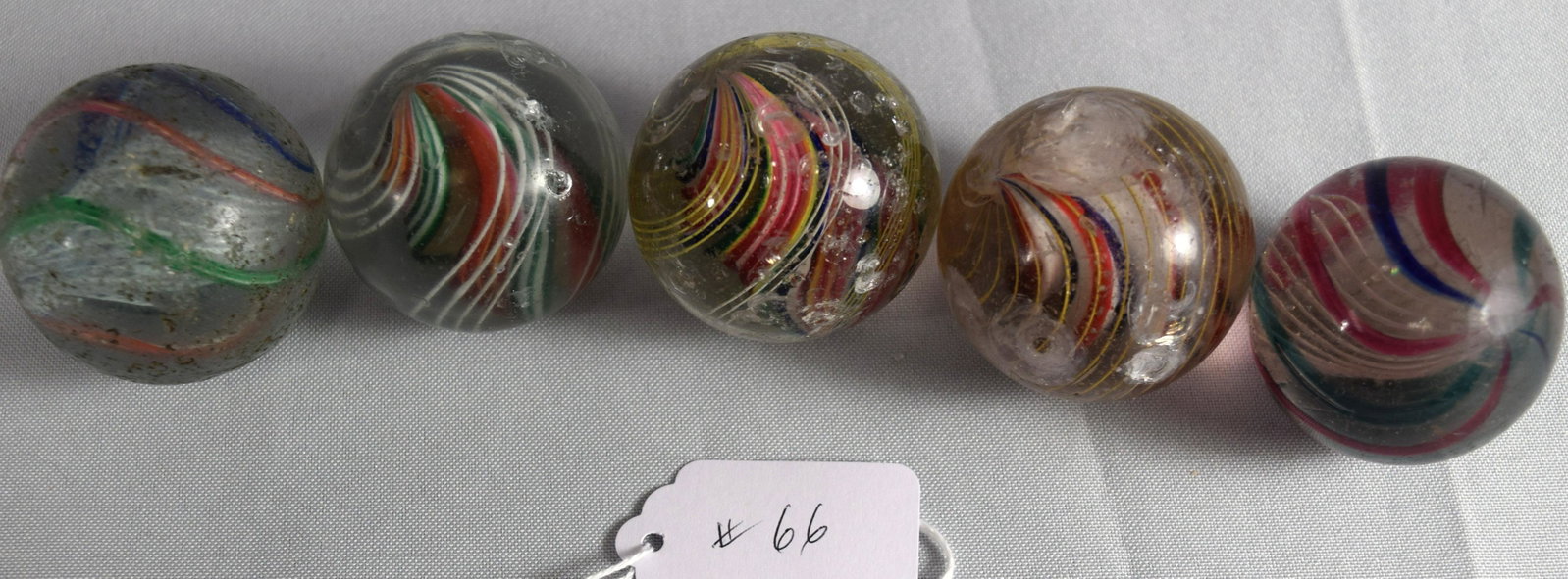 FIVE GERMAN 19TH C HANDMADE GLASS MARBLES:: Ca 1880-1890. Each approx. 1 5/8 inches diameter. Swirl marbles.