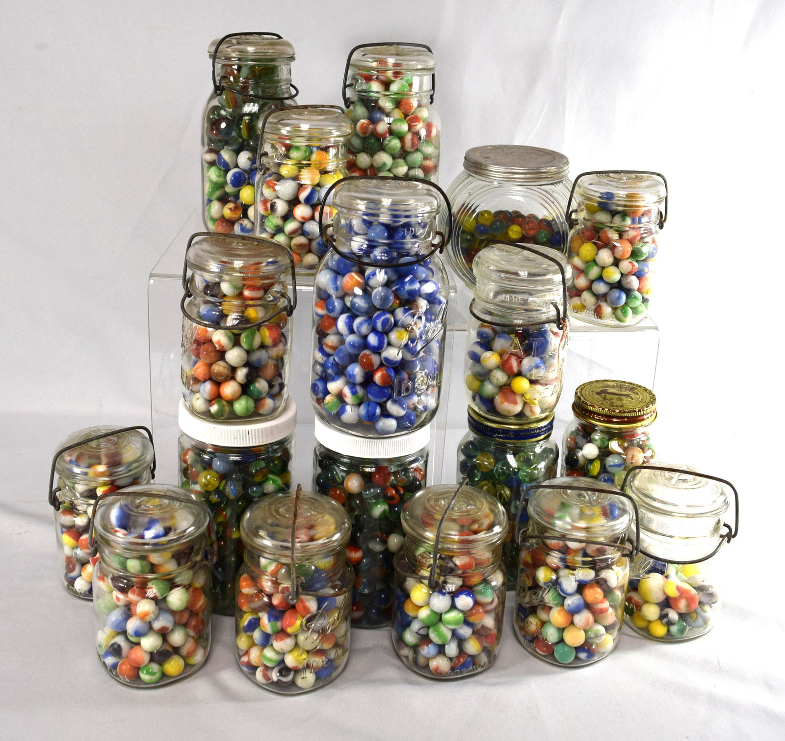 20 JARS of EARLY ASSORTED APPROX. 2,000 VINTAGE MACHINE: Consisting of cat’s eyes, Marble King and etc. 20 jars of marbles. Various sizes and styles.