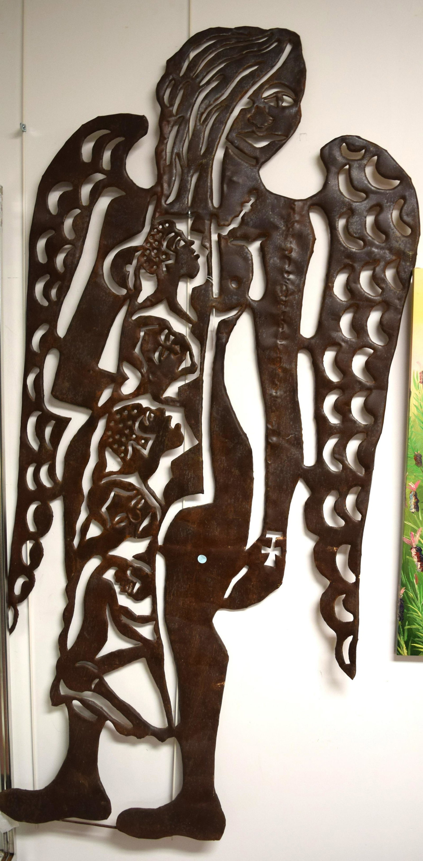 MURAT BRIERRE ABSTRACT METAL SCULPTURE:: Murat Brierre or Murat Briere (Haiti 1938–1988). “Angel of Death”. Large intricate metal cut our wall sculpture. Winged female figure with 5 internal faces and figure. Rust patina. Measures a