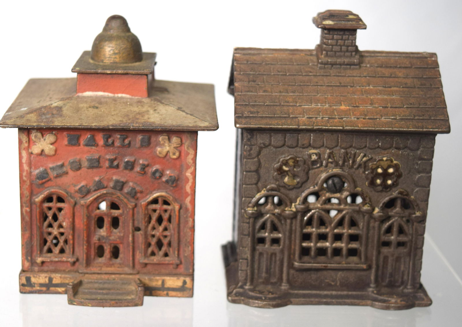 TWO CAST IRON BUILDING STILL BANKS: (1 of 5)