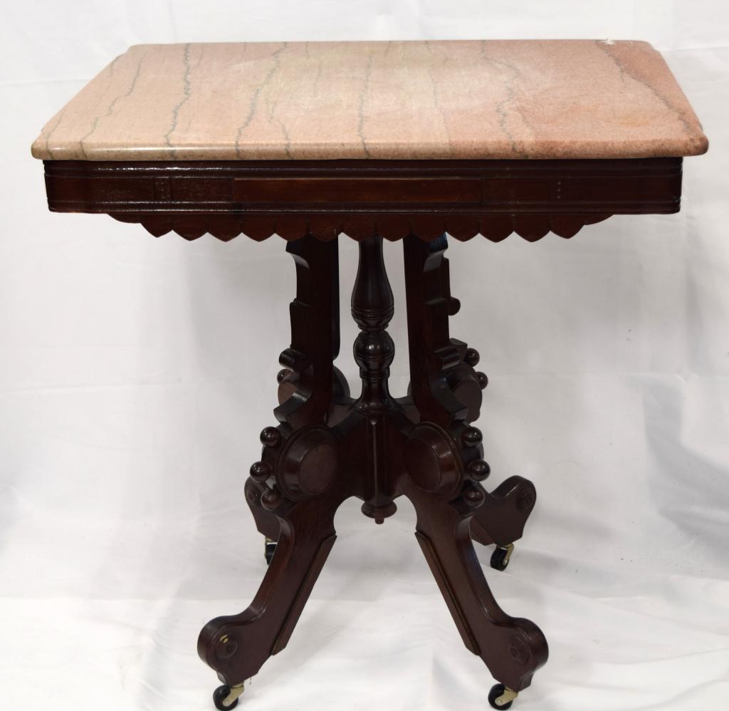 VICTORIAN ROSE MARBLE TOP TABLE:: 19th century. Rectangular walnut with rose marble table with tripod base with castors. Ball decoration. Measures 28 inches x 20 inches x 30 inches tall. Shaped corners. Some stains on marble, replaced