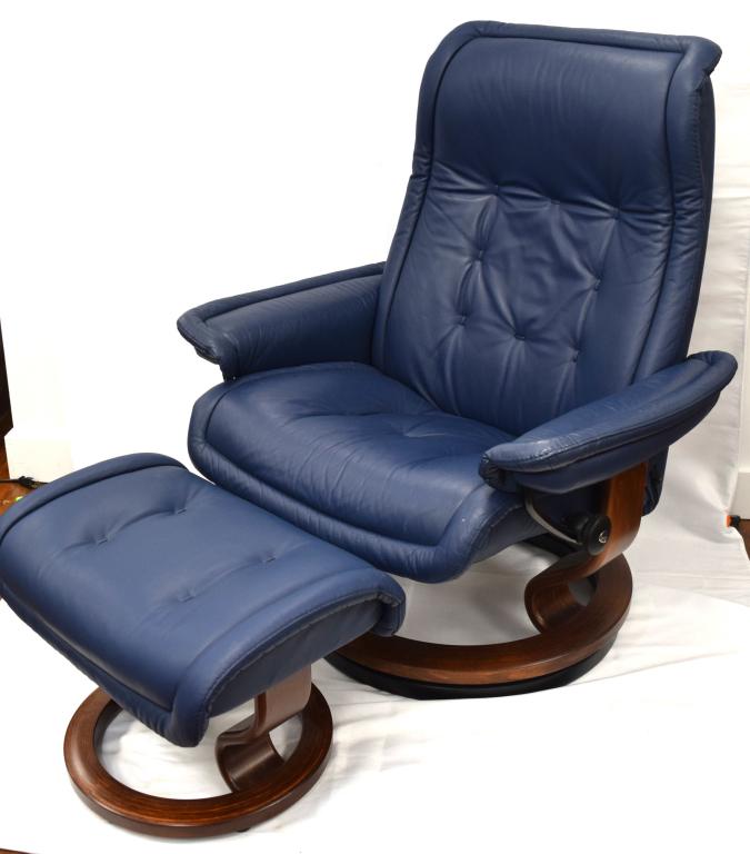 EKORNES NORWAY MODERN RECLINER AND OTTOMAN:: Blue leather Ekornes Norwegian stress less chair and ottoman. Dimensions - 39 inches x 34 inches x 34 inches. Signed. Good condition.