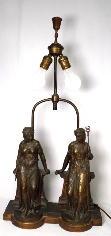 GRAND TOUR BRONZE CLASSICAL REVIVAL FIGURAL LAMP:: Unusual antique bronze lamp. Double light. Two classical standing women in ornate draping costumes. Both leaning on a plynth. One with a rose in one hand and staff in the other. Figures measure 12 inc