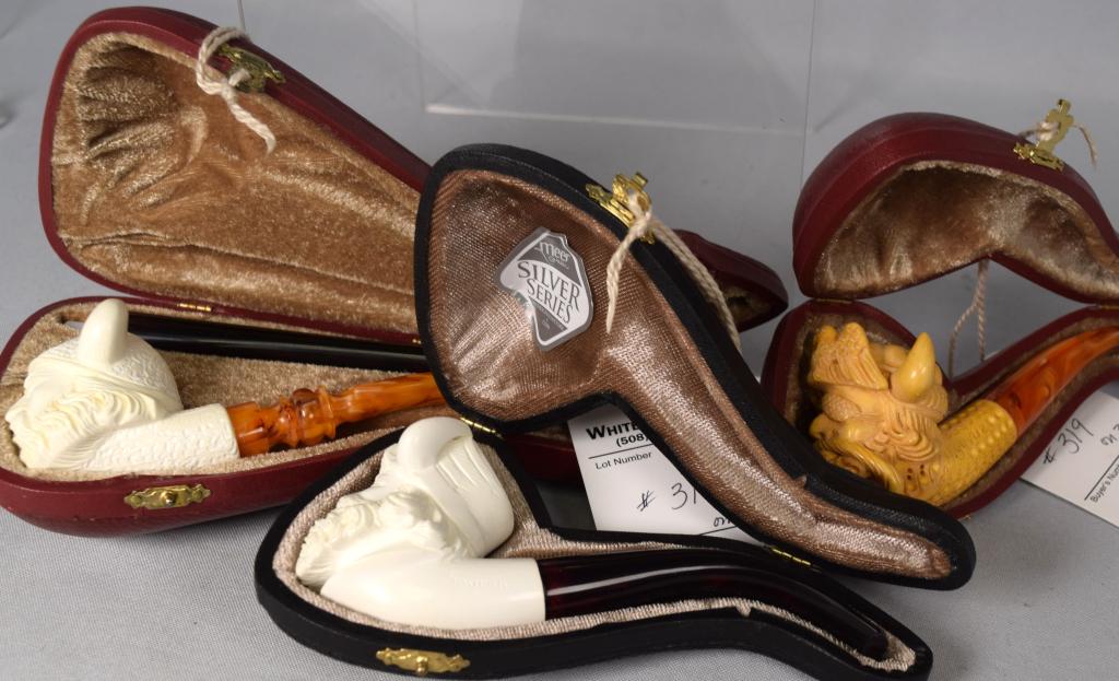 3 BLOCK MEERSCHAUM FIGURAL VIKING PIPES: Three pipes. One signed Mustate with two mouth pieces. 2) Signed H. Yovuz with marbleized mouth piece. 3) Signed Savrah with amber mouth piece. All with Original fitted leather case with velvet interi