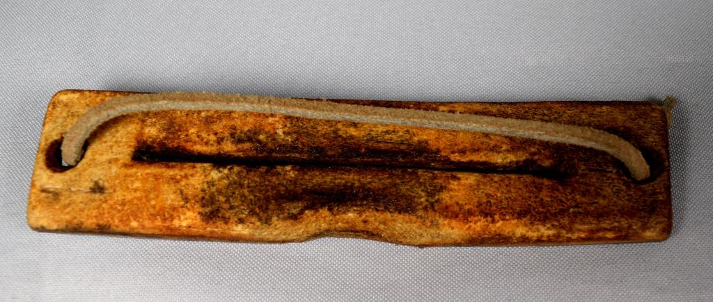 INUIT ANTLER SNOW GOGGLES: Early antler Eskimo Inuit snow goggles. Made from caribou antler. Measures 5 1/2 inches x 1 1/4 inch. Early Eskimos made their own snow goggles to protect them from the bright sunlight reflecting off 