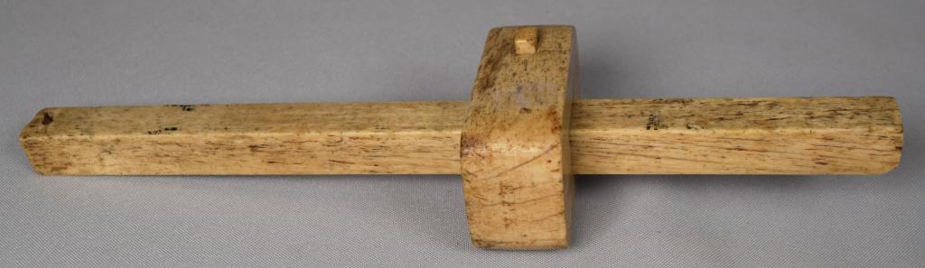 WHALE BONE MARKING SCRIBE WITH WEDGE LOCK: Antique whale bone marking scribe tool with a wedge lock. Initals E.F.K. Approximately 10 inches long x 2 1/2 inches wide. Good condition.