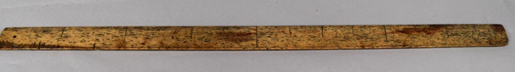 EARLY WHALE BONE CENTER FINDING RULE: Scratch date 1671 and initials. Measures 20 1/2 inches long. Hand scratched measurements. Good condition.