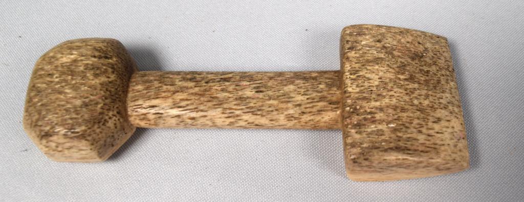 CARVED FIGURAL WHALE BONE SEAM RUBBER: Antique whale bone carved seam rubber. Measures 5 inches long x 1 7/8 inches wide. Good condition.
