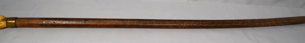 WHALE IVORY LOG RULER WALKING STICK: Whale bone knob. Inscribe gold plated collar with owners name, illegible. The walking stick with many sides of the shaft with many measurements. These we believe represent inches of what is probably t