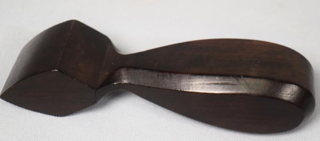 EBONY SEAM RUBBER: Carved ebony seam rubber. 4 1/2 inches long. Good condition.