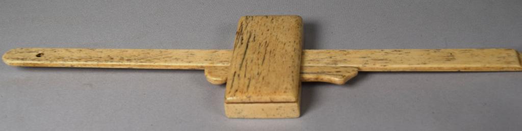 WEDGE WHALEBONE MARKING GAGE: 19th/20th whale bone marking gage. 13 1/2 inches long. 3 1/2 inches wide. Good condition.