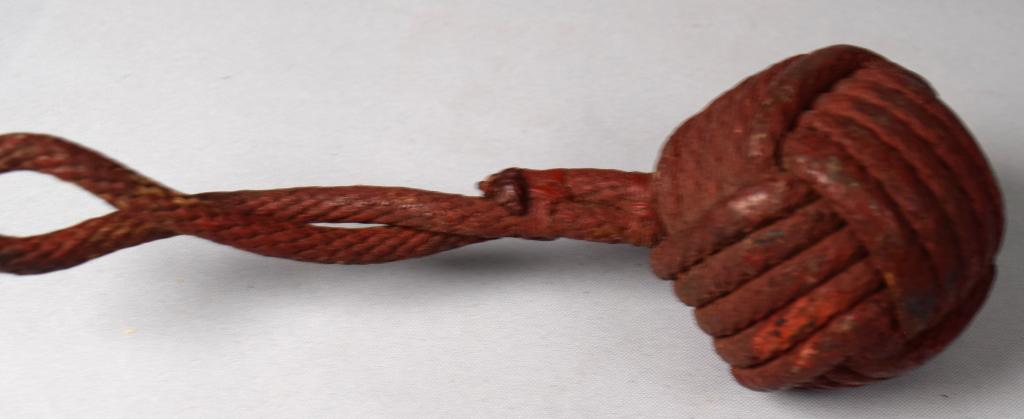 19TH C SAILORS ROPE THROWING NAG: Braided rope weight end, 8 inches long. Original red paint. Good condition.
