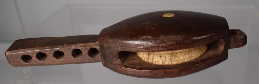 FANCY EBONY AND WHALE BONE ADJUSTABLE PULLEY: Approx. 6 inches long. 1 3/4 inches wide. Age split. Good condition.